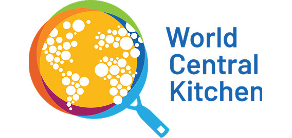 A magnifying glass highlights a yellow circle filled with white bubbles, alongside the text "World Central Kitchen."